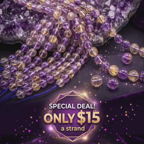 Promotional graphic for a video of Ametrine Beads featuring multiple strands of round, translucent purple and golden-yellow beads draped over a raw amethyst crystal on a dark purple velvet background. Text on the image reads: AMETRINE BEADS. SPECIAL DEAL! ONLY $15 a strand (Regular Price: $36)