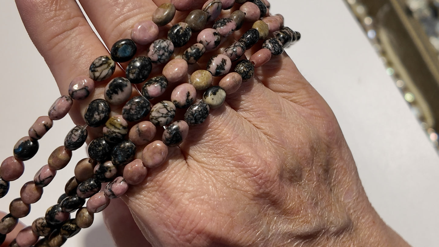 Natural gemstones 6x8mm approx 16" strands flat olive shape.  $10 a strand!