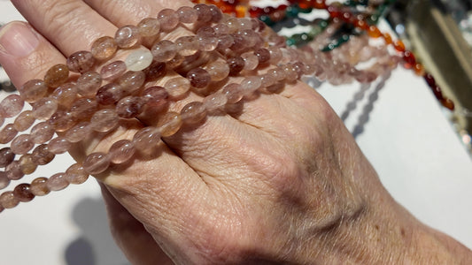 Natural gemstones 6x8mm approx 16" strands flat olive shape.  $10 a strand!