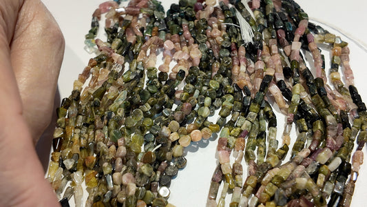 Tourmaline Beads Translucent/Transparent.  Primitive cut approx 15" strands.  Natural