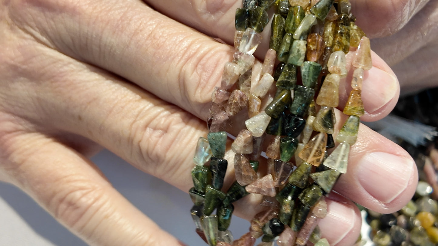 Tourmaline Beads Translucent/Transparent.  Primitive cut approx 15" strands.  Natural