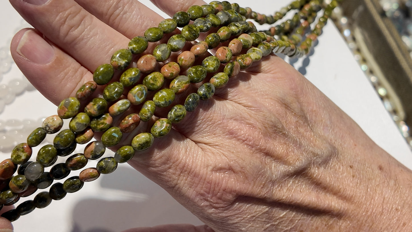 Natural gemstones 6x8mm approx 16" strands flat olive shape.  $10 a strand!