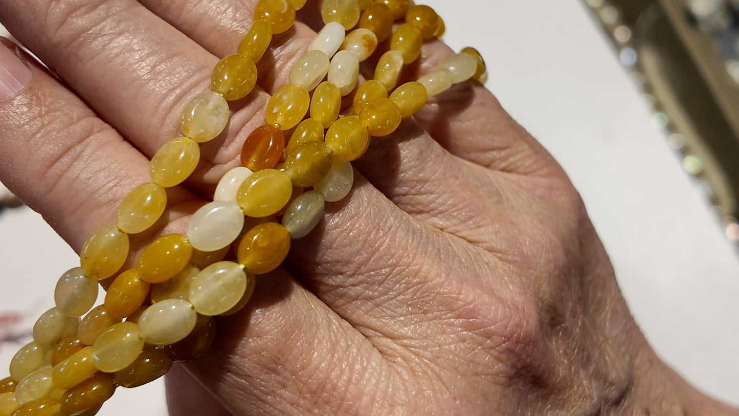 Natural gemstones 6x8mm approx 16" strands flat olive shape.  $10 a strand!